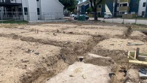 Trenching out for plumbing rough-in for 16 unit multifamily building